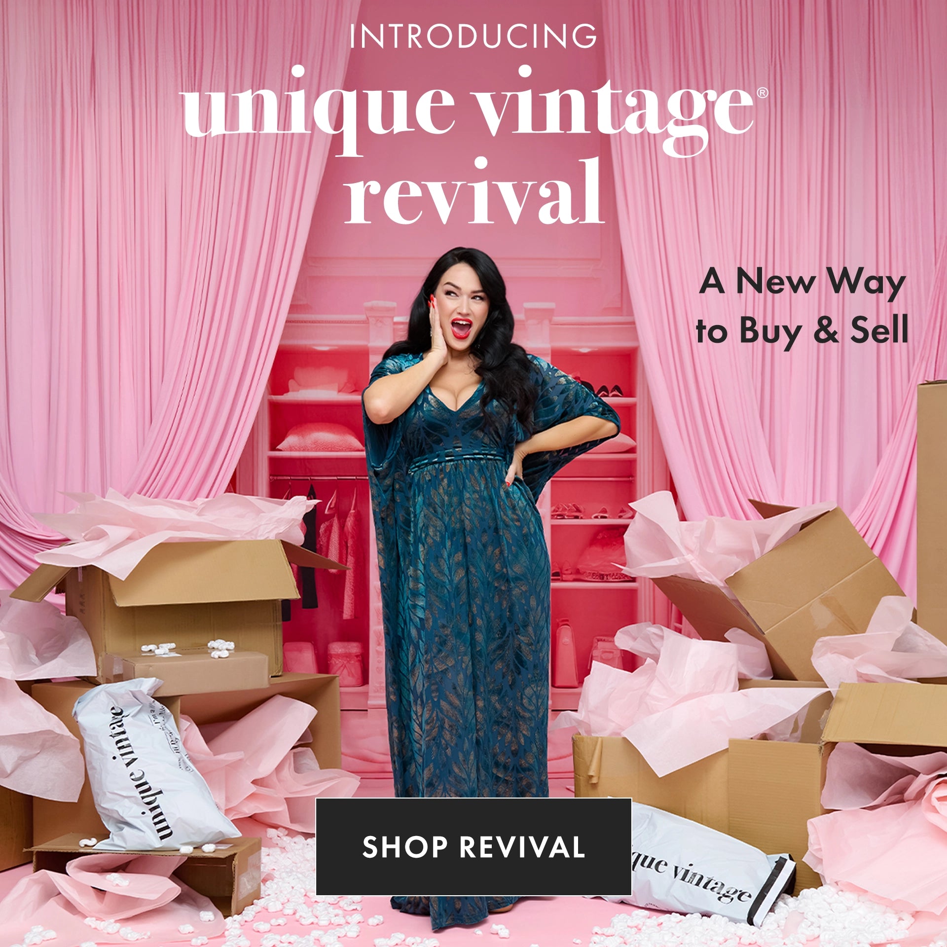Woman in a blue dress standing amidst boxes with 'unique vintage revival' branding.