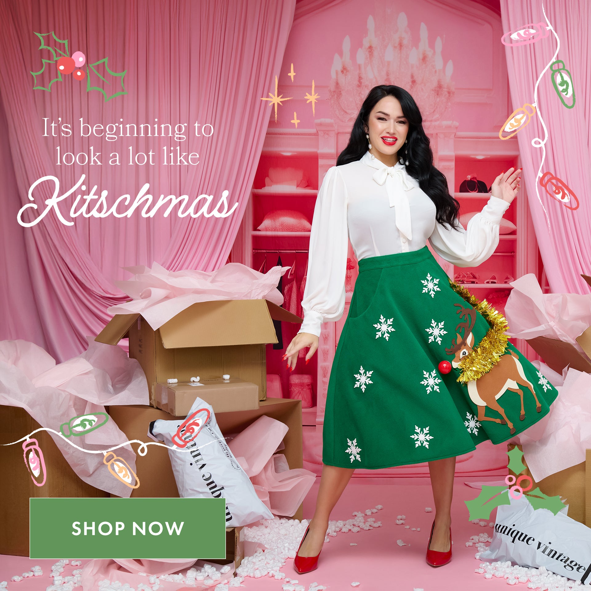 Woman in a festive outfit with text 'It's beginning to look a lot like Kitschmas' in a decorated room.