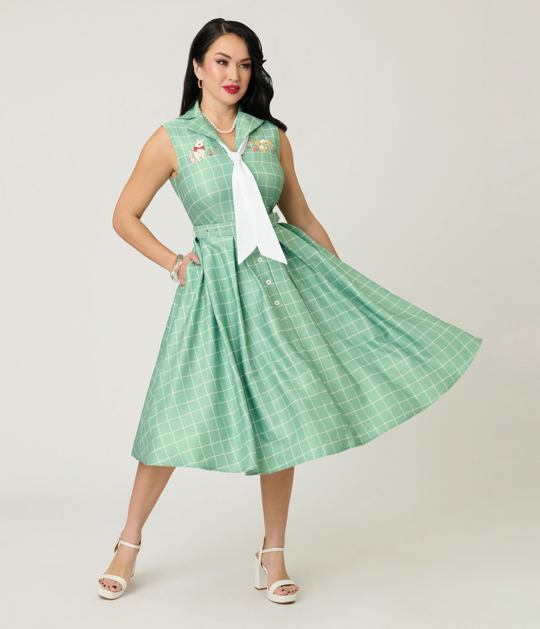 the swinger green dress Disney Winnie the Pooh x Unique Vintage Green Plaid Edith Swing Dress