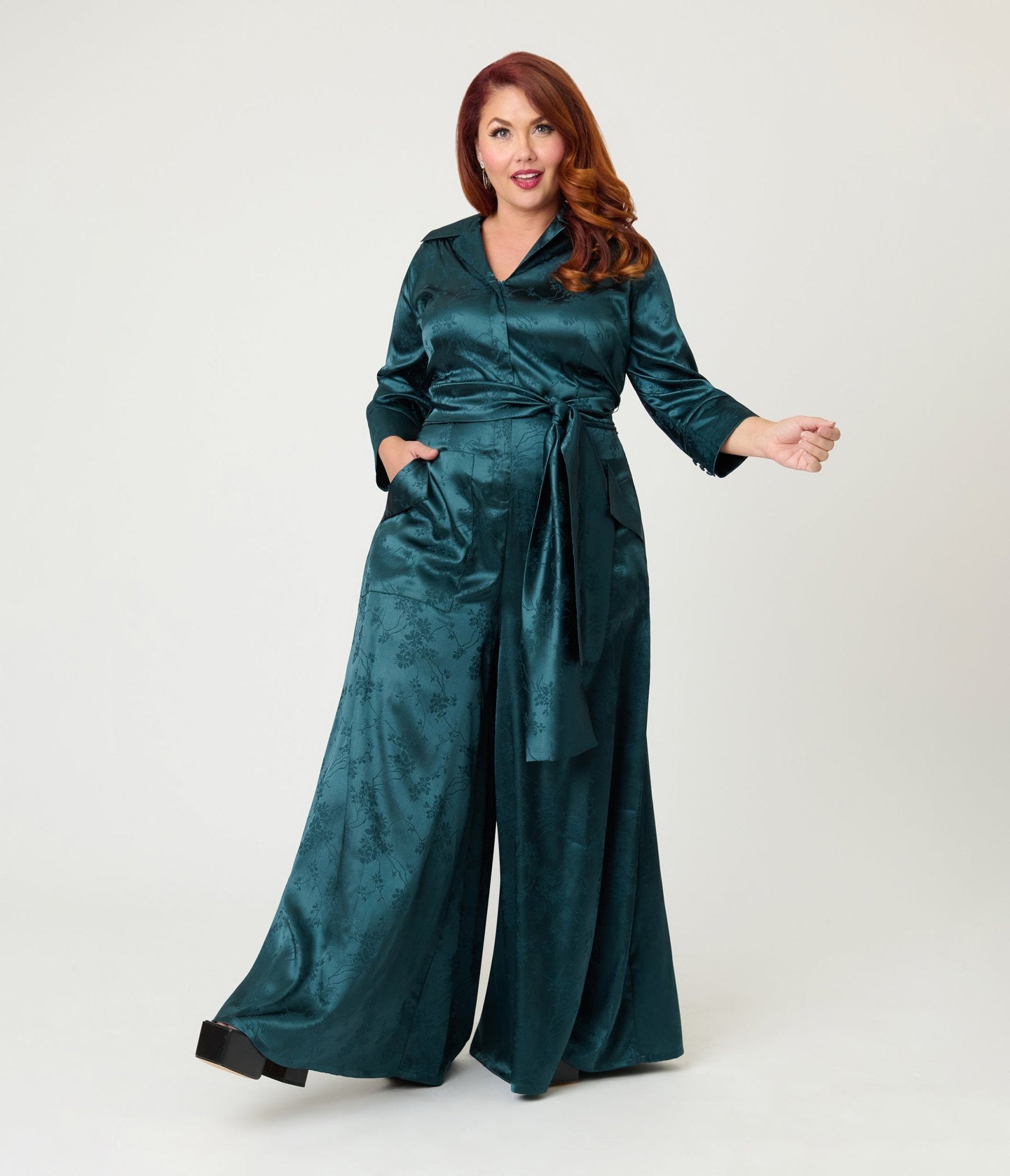 Unique Vintage Plus Size Teal Jacquard Satin Flare Jumpsuit Unique Vintage Plus Size Teal Jacquard Satin Flare Jumpsuit