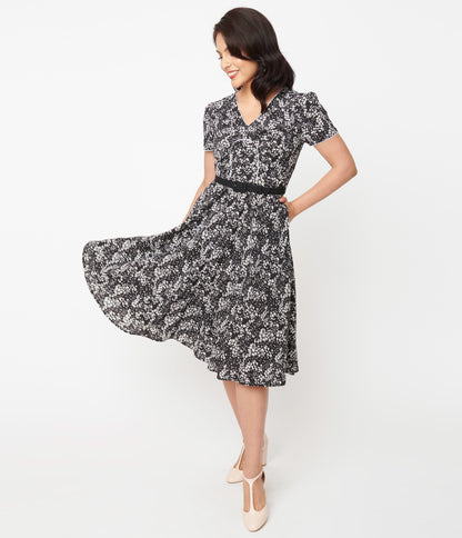 1950s Unique Vintage Black & Ivory Ditzy Floral Petula Swing Dress