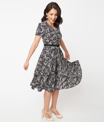 1950s Unique Vintage Black & Ivory Ditzy Floral Petula Swing Dress