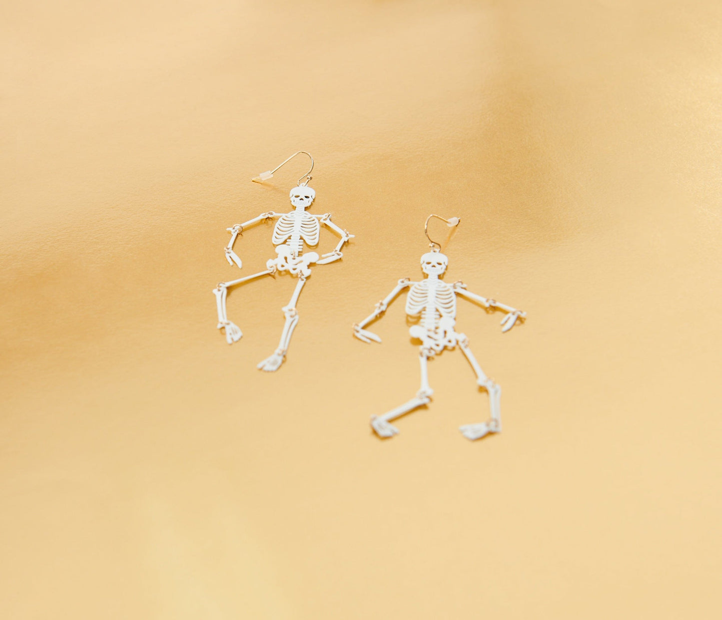 White Dancing Skeleton Earrings
