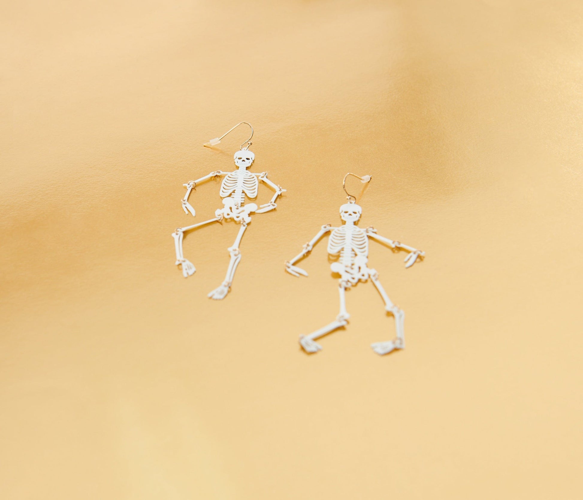 White Dancing Skeleton Earrings