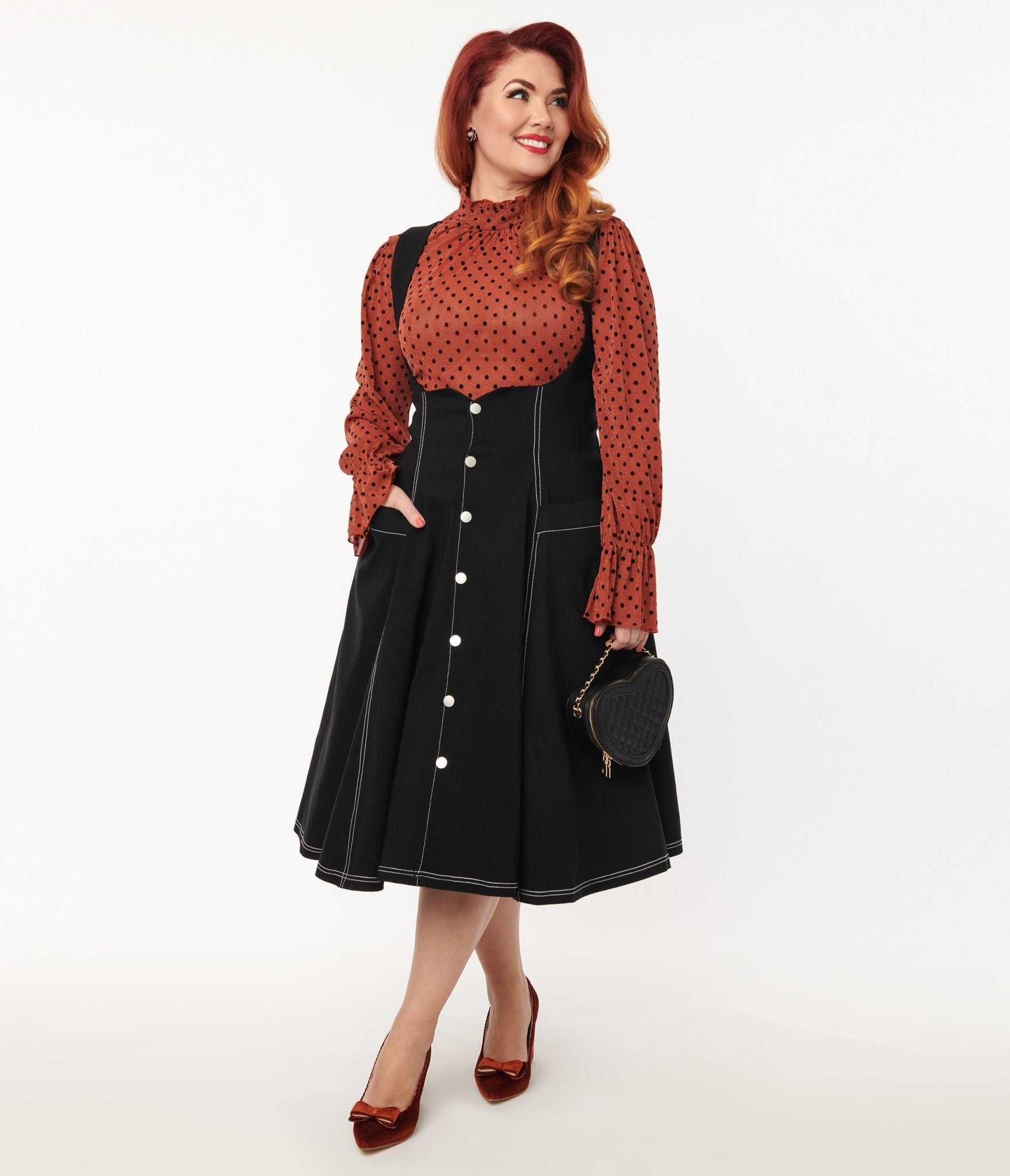 Button skirt outlet with suspenders