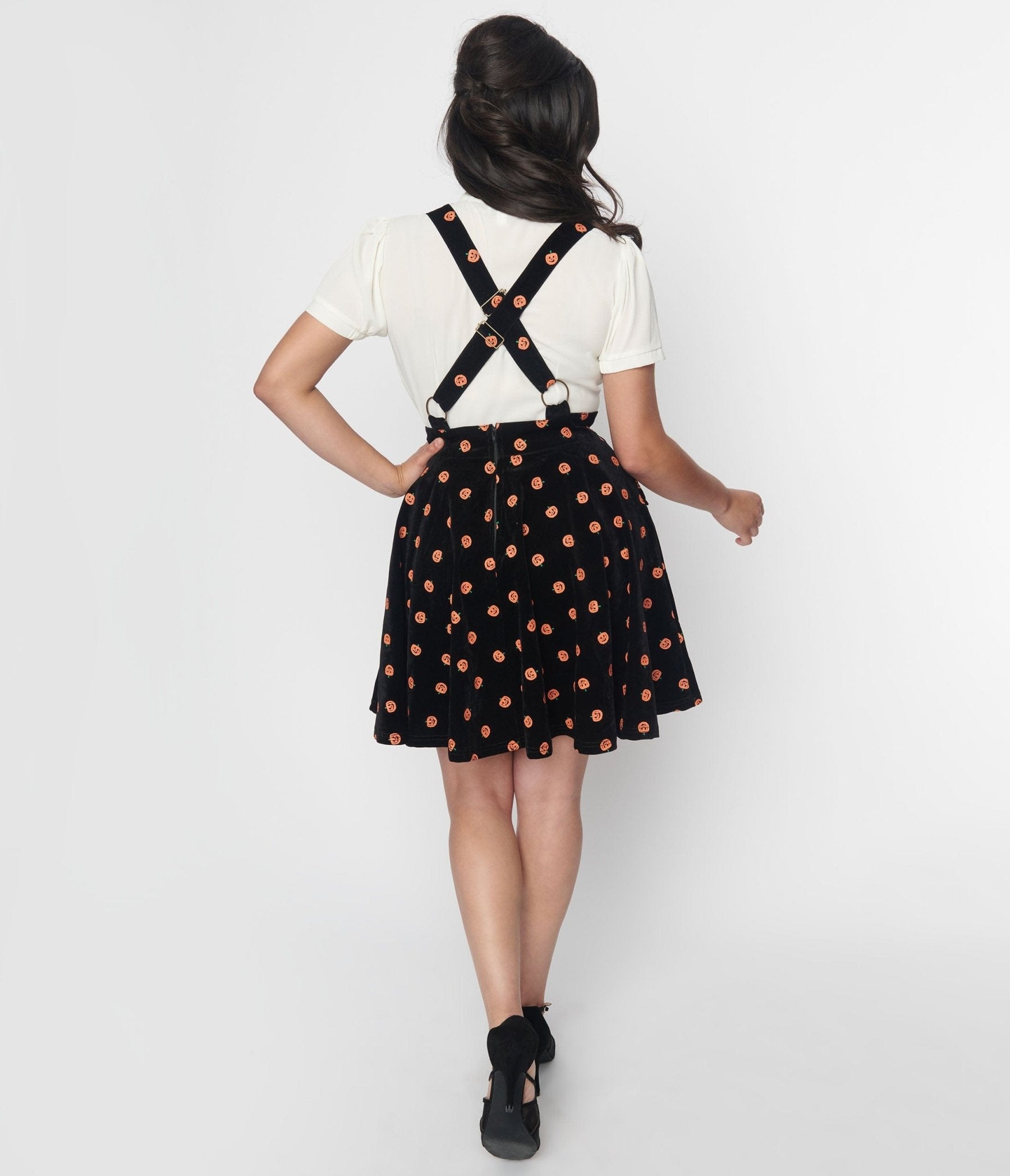 ASOS DESIGN mini ribbed pinafore skirt with tie straps in black | ASOS