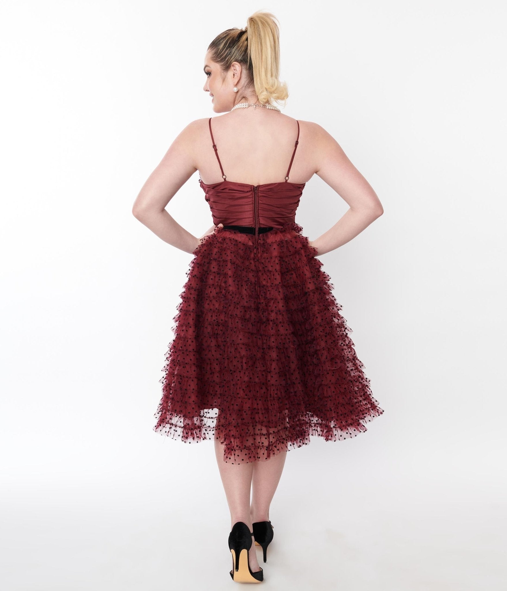 A Floral embroidered, strapless tulle dress with wine colored tulle fabric.